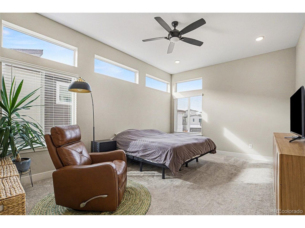 9958 East 63rd Place, Unit 2 Denver, CO 80238 - Photo 11 of 35 a bedroom with furniture and window