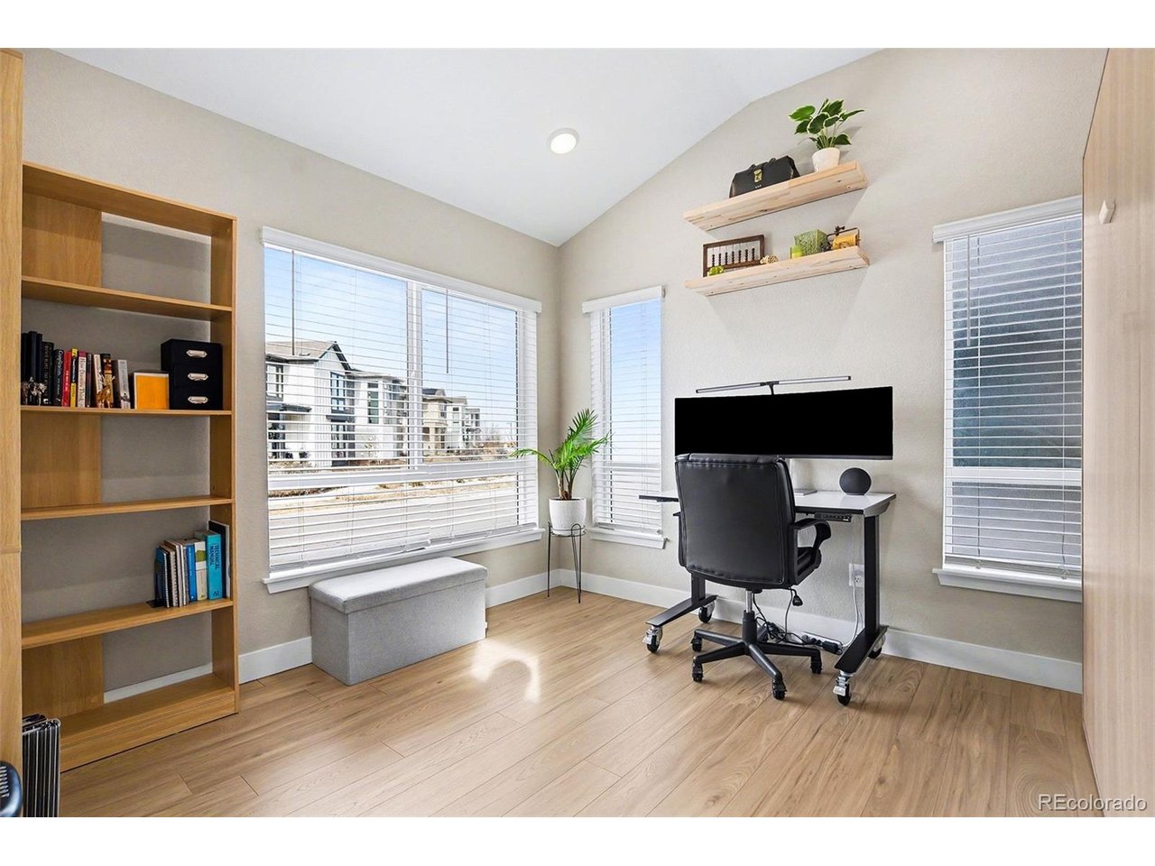 9958 East 63rd Place, Unit 2 Denver, CO 80238 - Photo 19 of 35 a living room with furniture and a fireplace