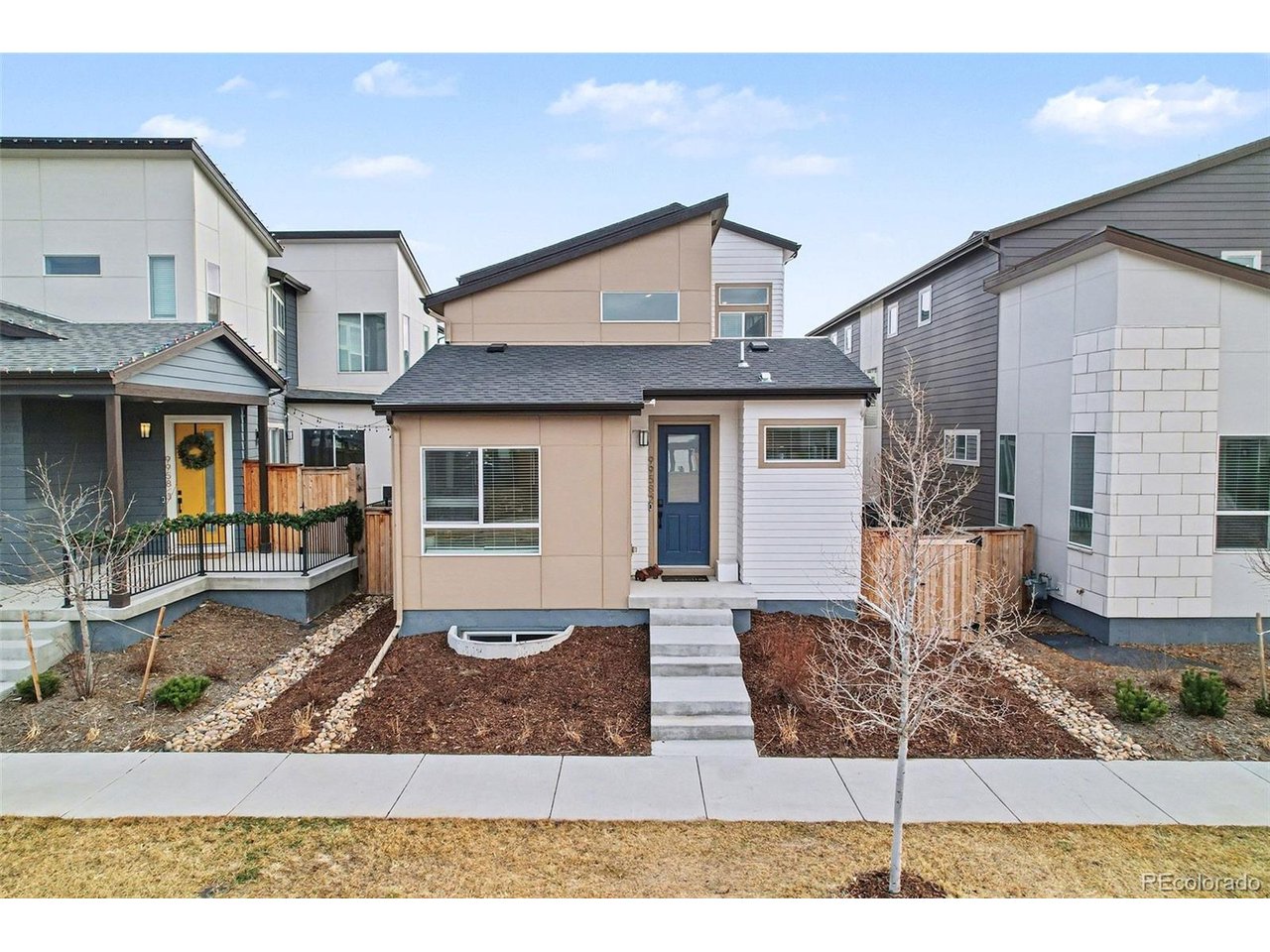 9958 East 63rd Place, Unit 2 Denver, CO 80238 - Photo 2 of 35 a view of a house with backyard