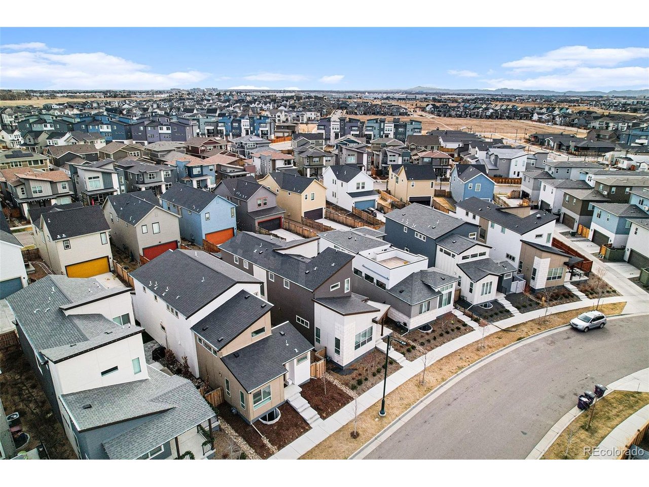 9958 East 63rd Place, Unit 2 Denver, CO 80238 - Photo 3 of 35 an aerial view of residential building with parking space