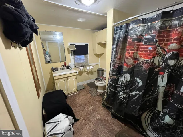 a kitchen with a sink appliances and cabinets