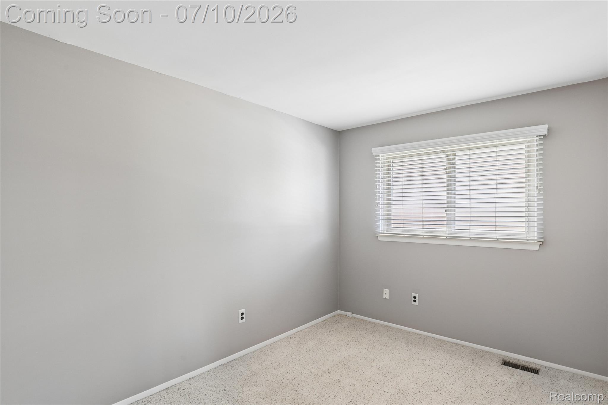 42698 Keystone Canton, MI 48187 - Photo 10 of 33 Room featuring light gray walls, white baseboards, and neutral carpet flooring