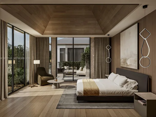 a bedroom with a large bed and a large window