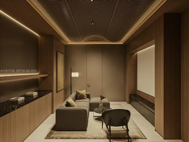 a lobby with furniture and a rug