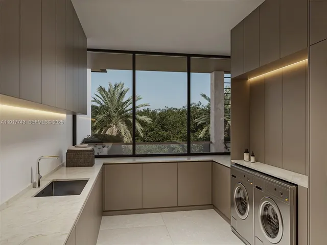 a view of a kitchen with a sink and dishwasher