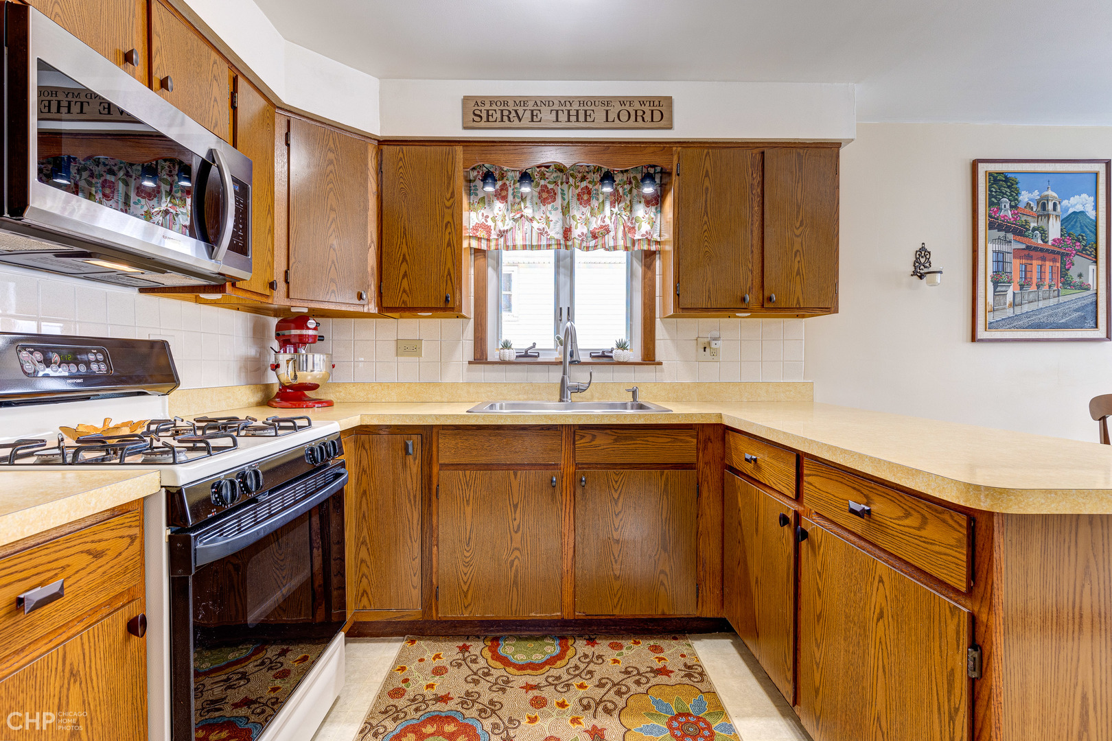 10808 Massasoit Avenue Chicago Ridge, IL 60415 - Photo 14 of 33 a kitchen with stainless steel appliances a stove a sink and a microwave