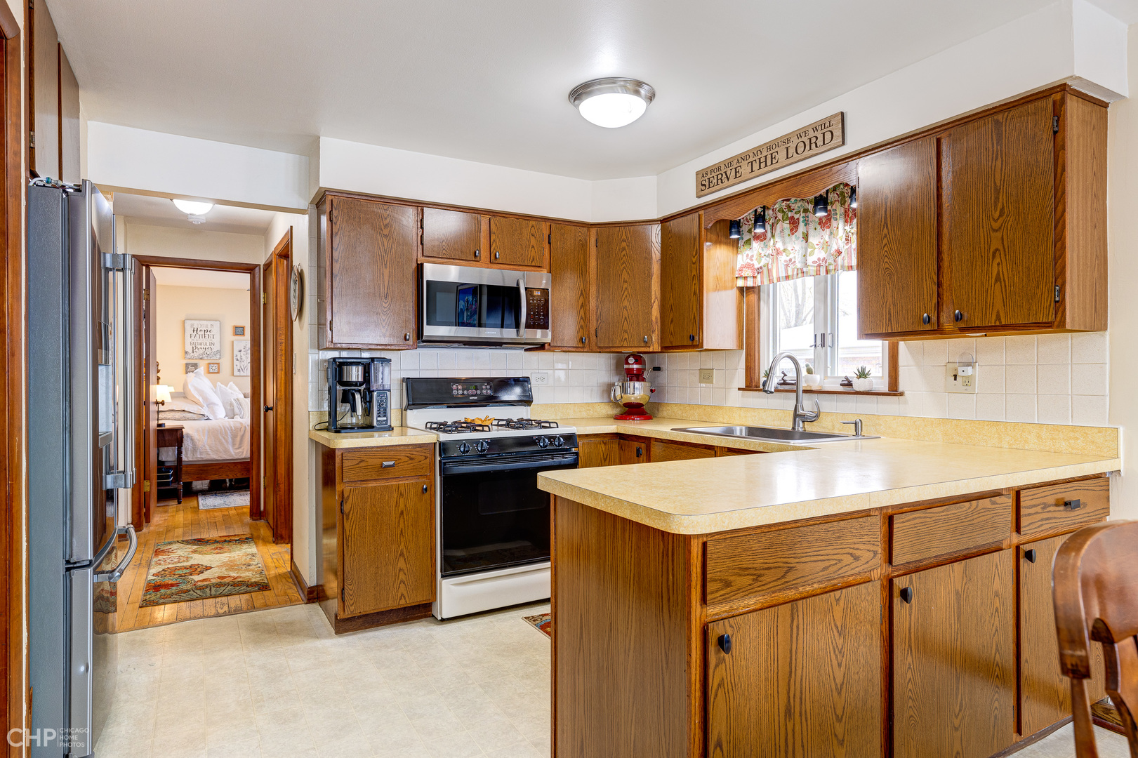 10808 Massasoit Avenue Chicago Ridge, IL 60415 - Photo 17 of 33 a kitchen with a sink stove top oven and refrigerator