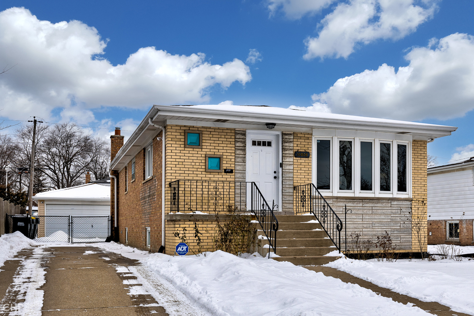 10808 Massasoit Avenue Chicago Ridge, IL 60415 - Photo 3 of 33 a front view of a house with a garage