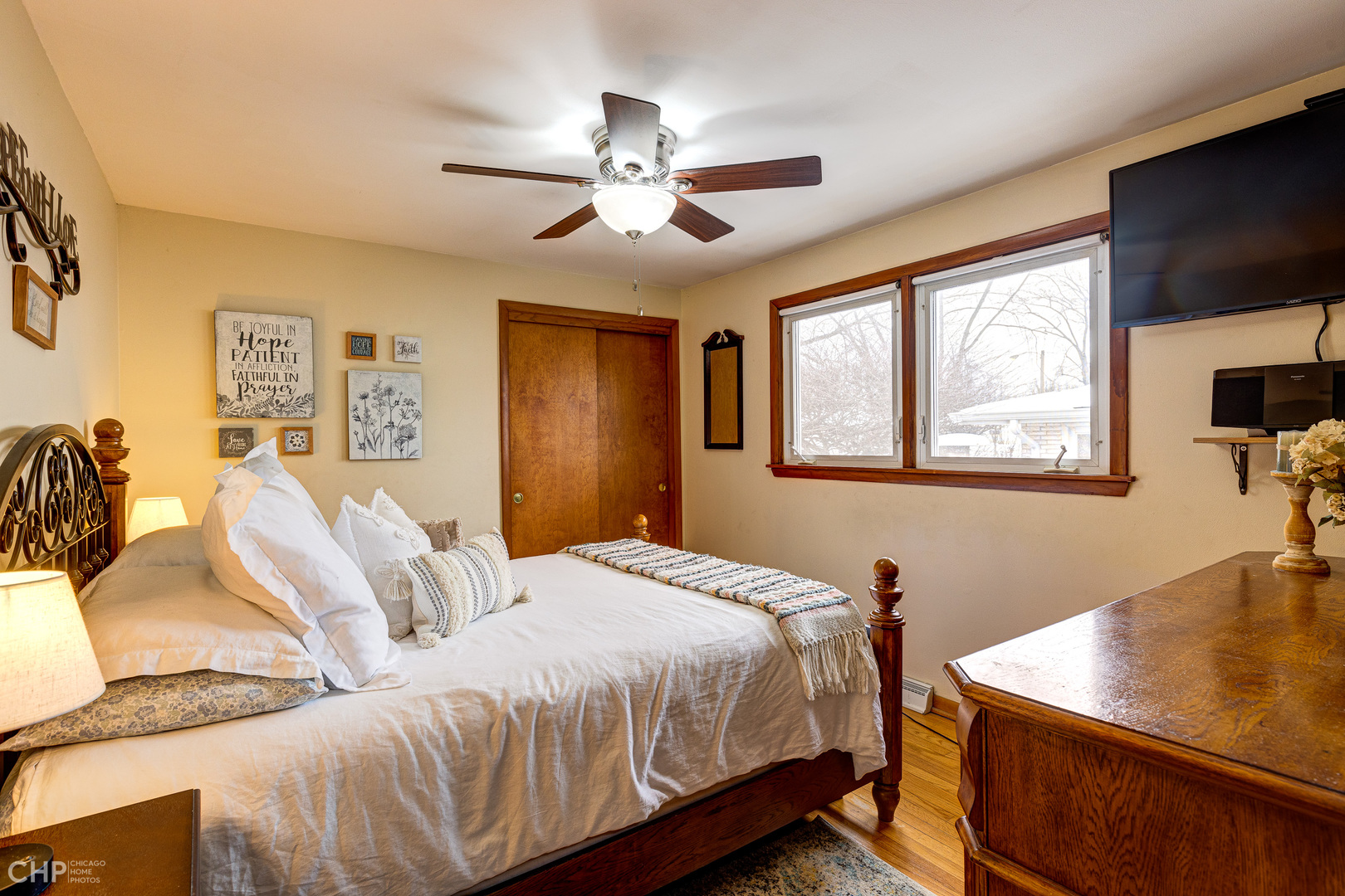 10808 Massasoit Avenue Chicago Ridge, IL 60415 - Photo 9 of 33 a bedroom with a bed and a flat screen tv