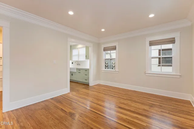 a kitchen with stainless steel appliances a stove microwave and cabinets