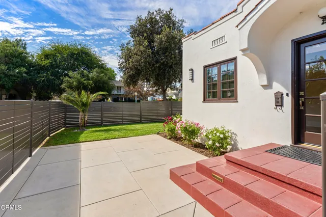 a flower plants in front of a house