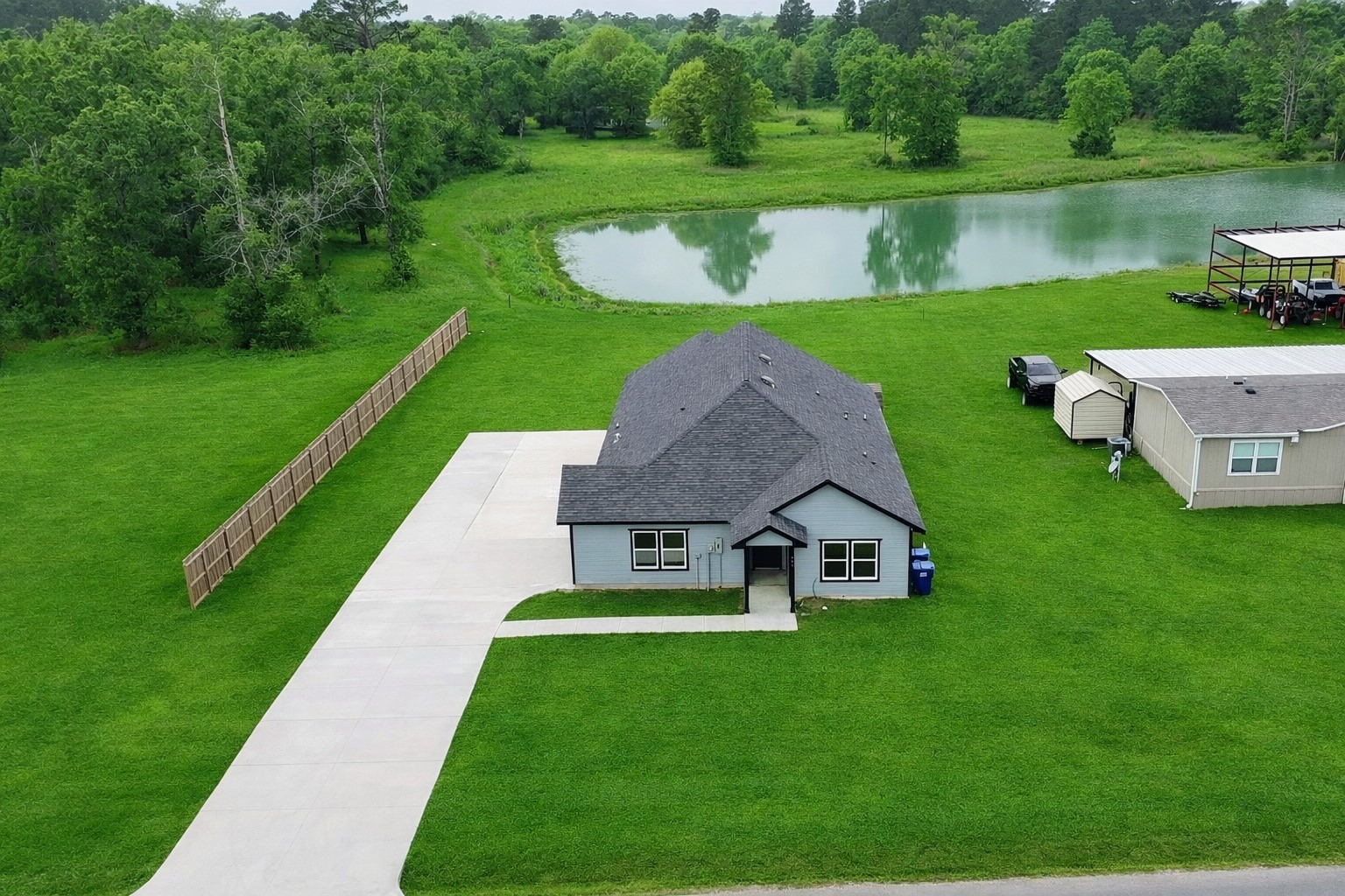 131 South Tyler Road Goodrich, TX 77335 - Photo 1 of 26 a view of a house with a yard table and chairs