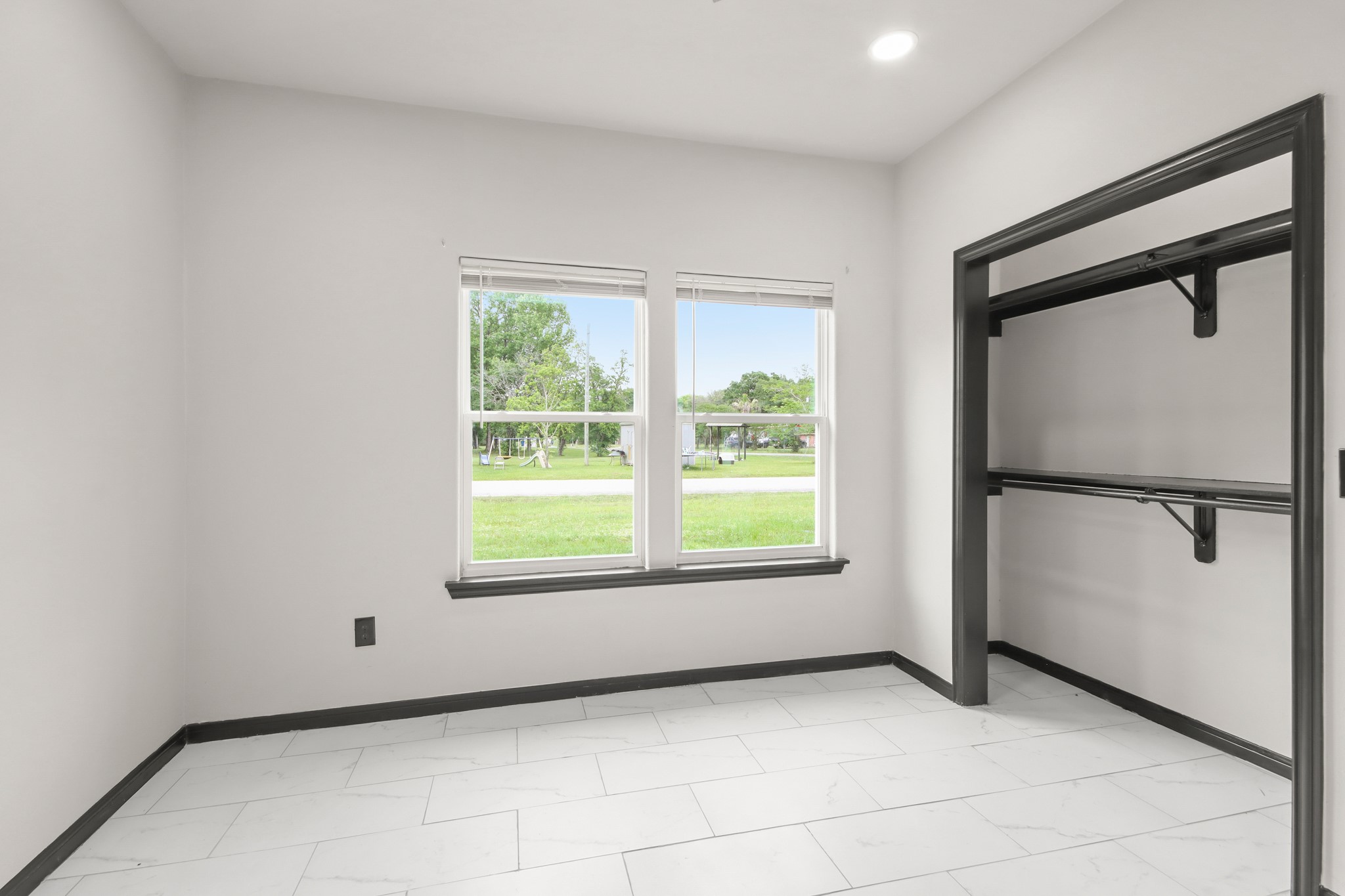 131 South Tyler Road Goodrich, TX 77335 - Photo 18 of 26 a view of an empty room with a window