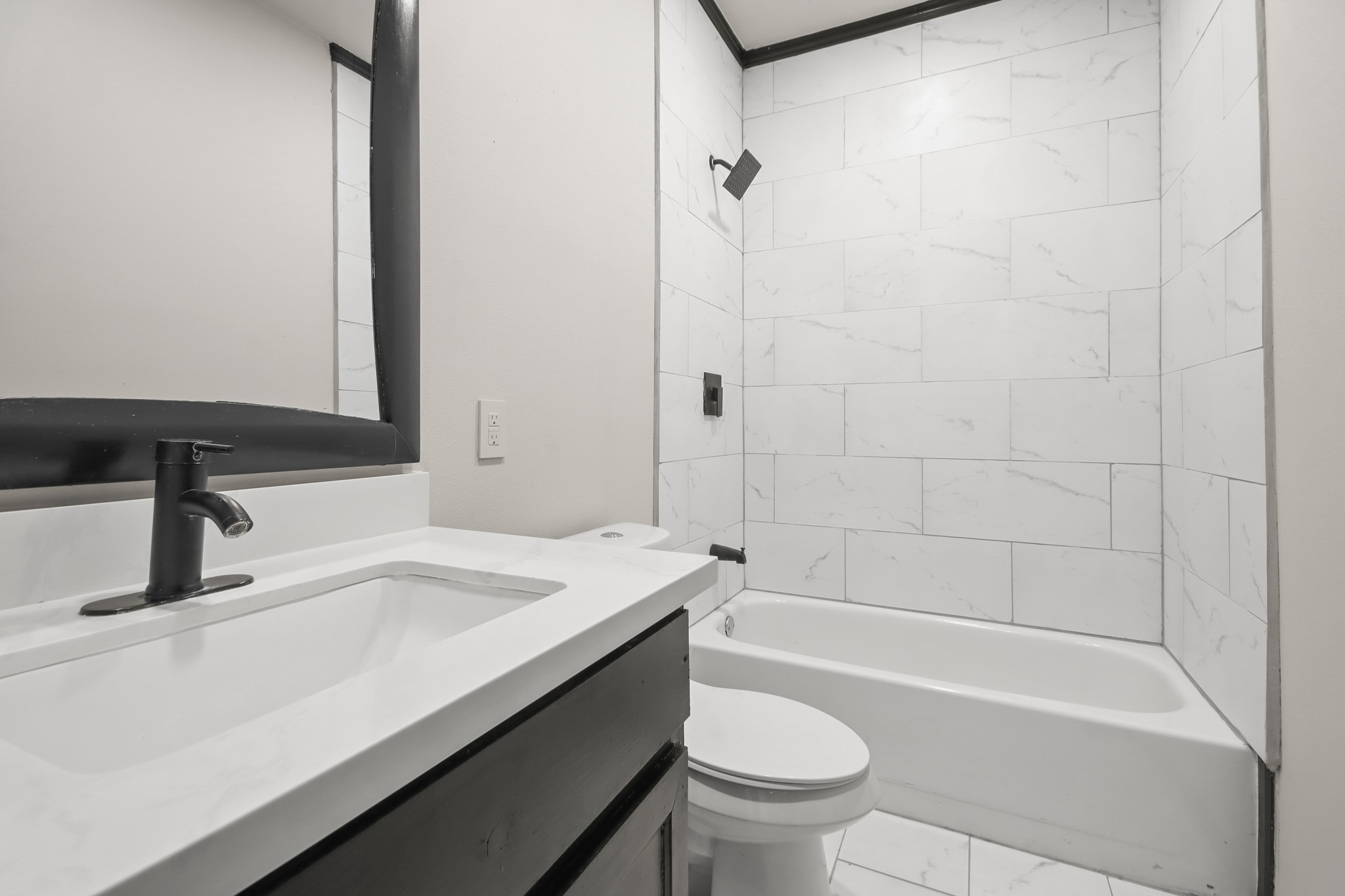 131 South Tyler Road Goodrich, TX 77335 - Photo 20 of 26 a bathroom with a sink a toilet a mirror and bathtub
