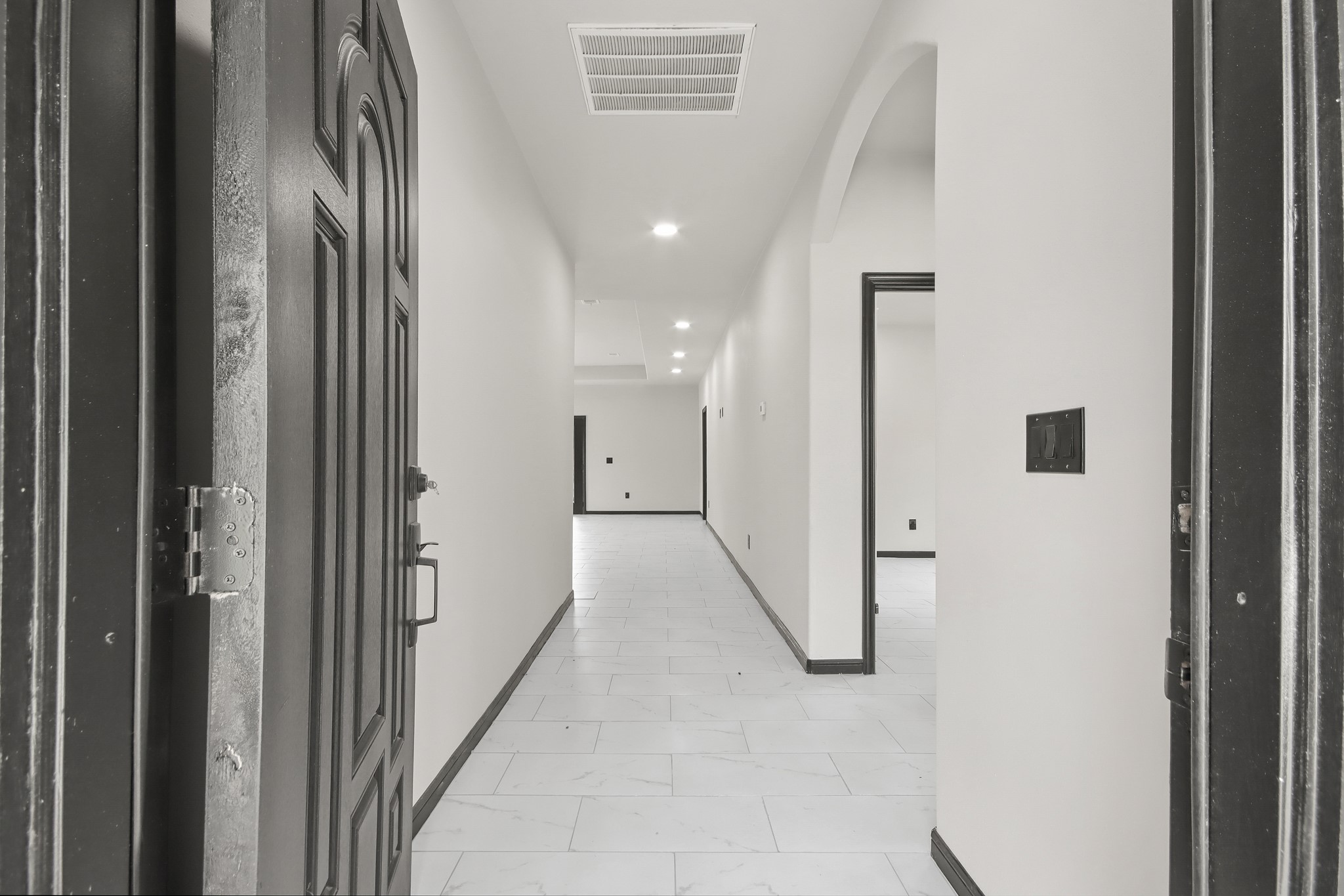 131 South Tyler Road Goodrich, TX 77335 - Photo 2 of 26 a view of a hallway with wooden floor