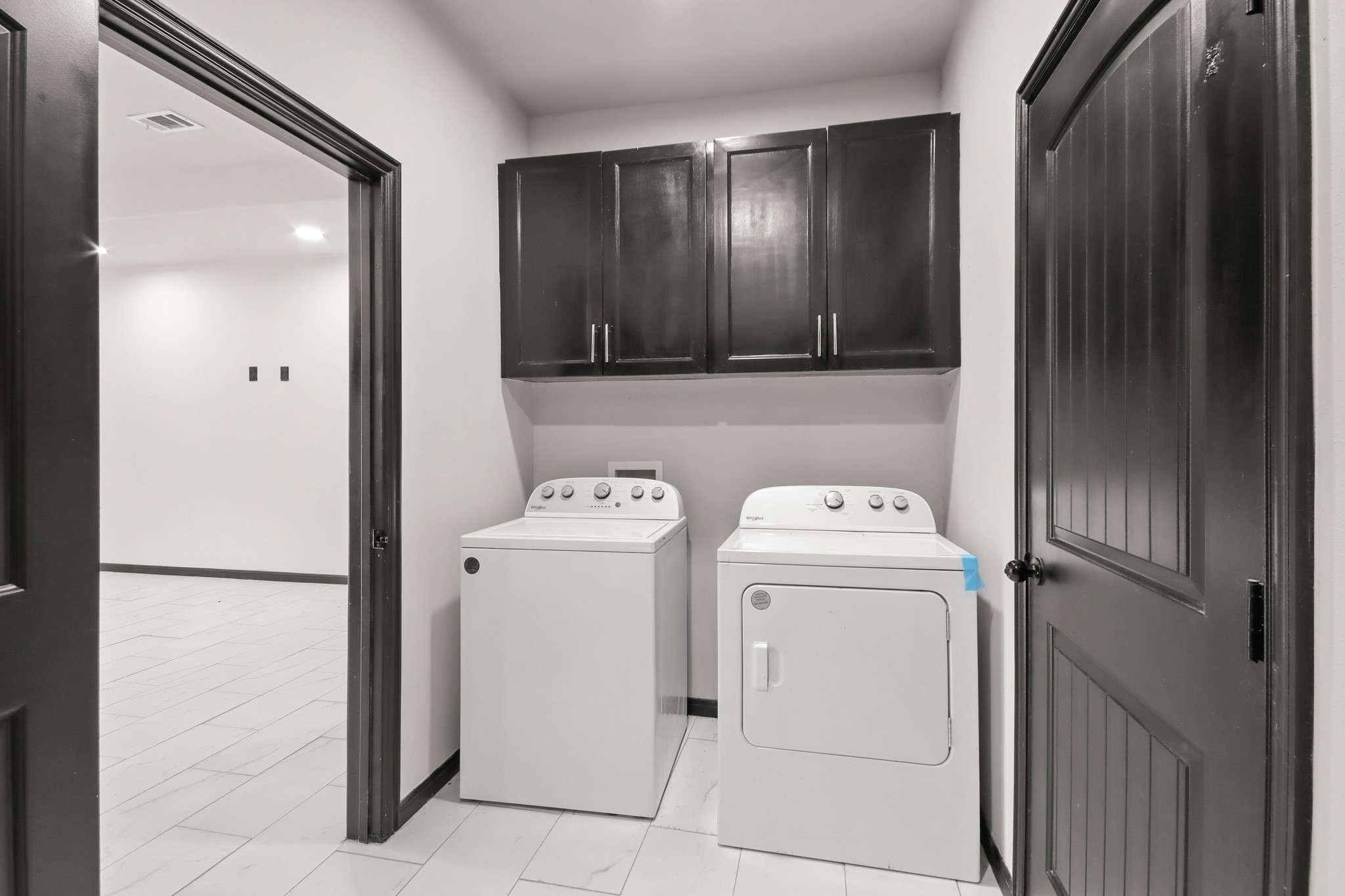 131 South Tyler Road Goodrich, TX 77335 - Photo 21 of 26 a view of storage and utility room with washer and dryer