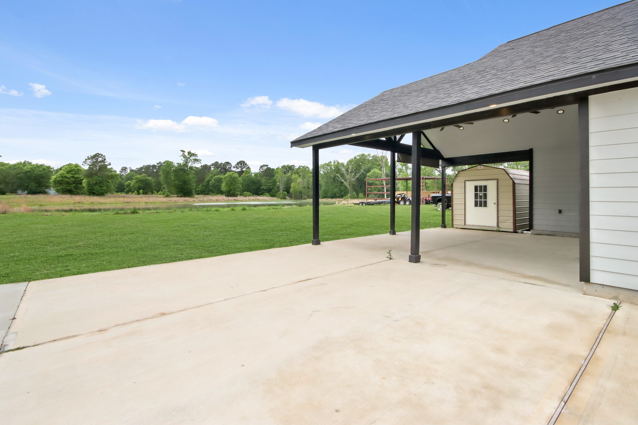 131 South Tyler Road Goodrich, TX 77335 - Photo 22 of 26 a view of a house with a yard