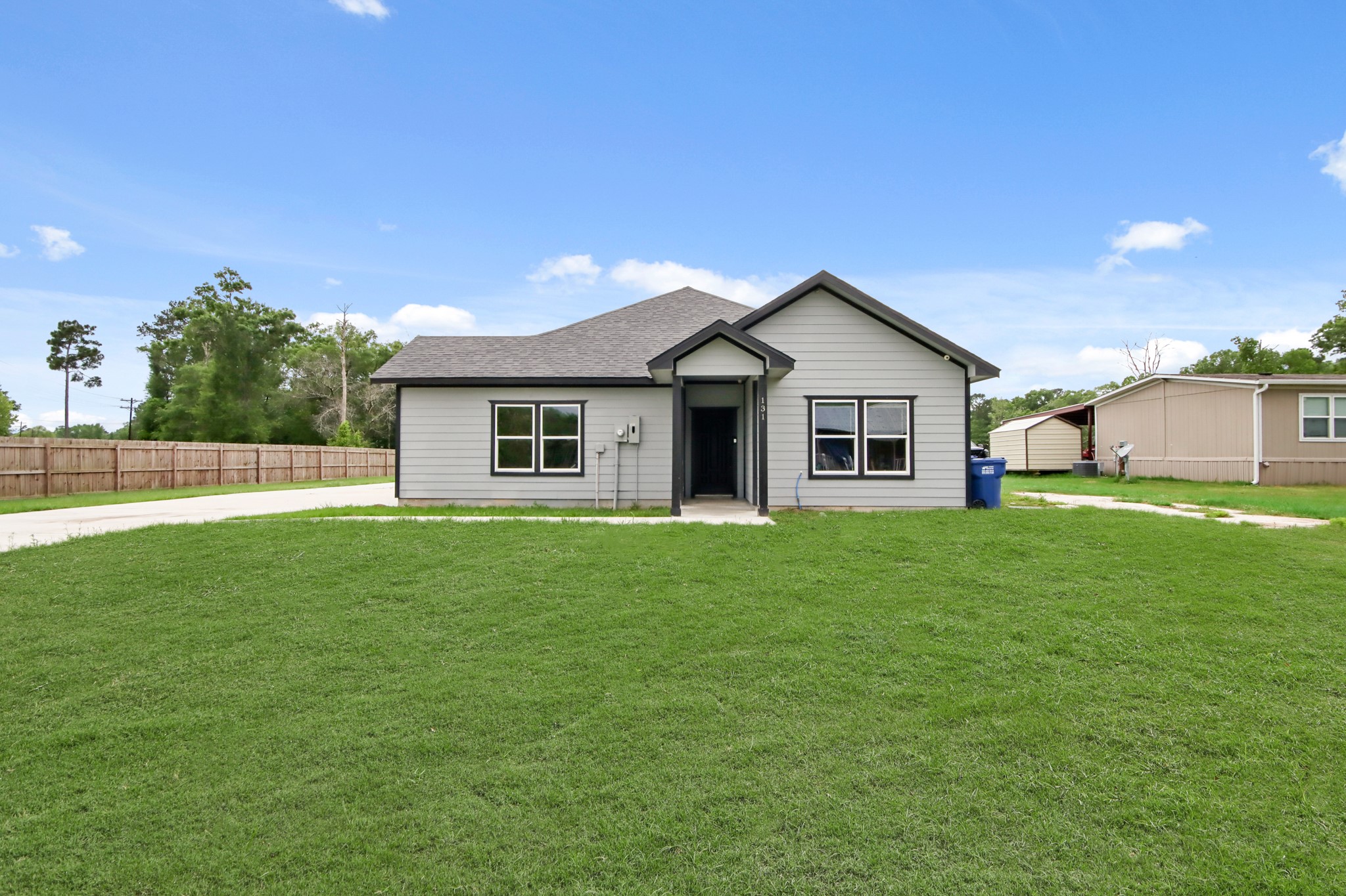 131 South Tyler Road Goodrich, TX 77335 - Photo 23 of 26 a view of a house with a backyard