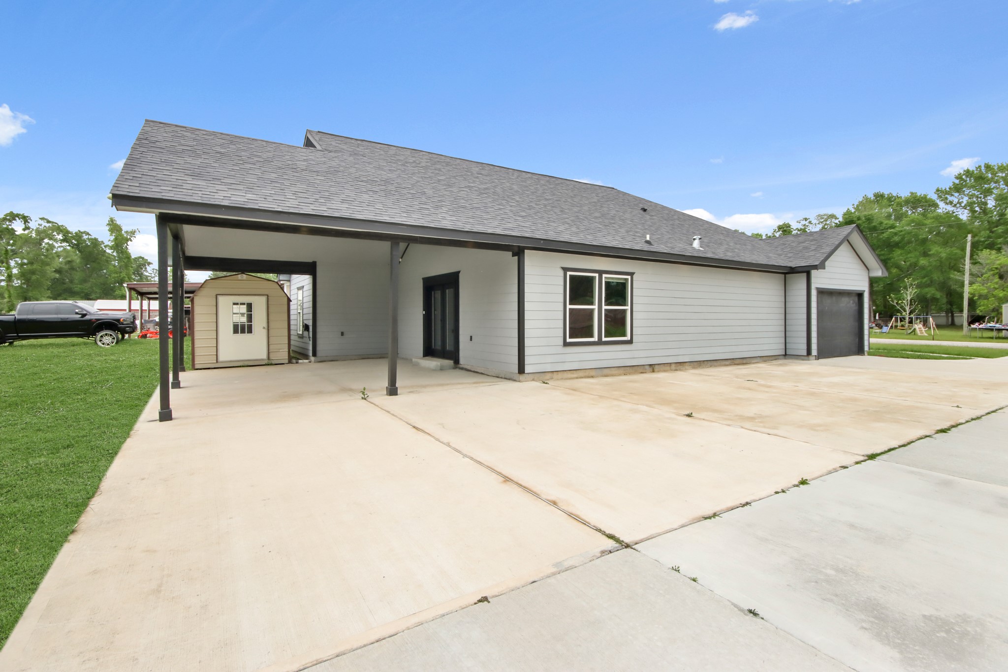 131 South Tyler Road Goodrich, TX 77335 - Photo 25 of 26 a front view of a house with a garden