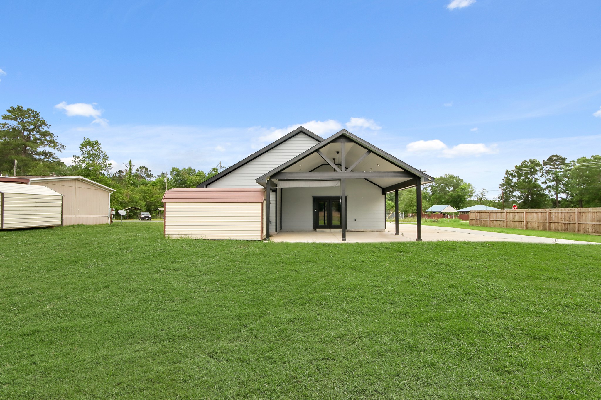 131 South Tyler Road Goodrich, TX 77335 - Photo 26 of 26 a front view of a house with a yard