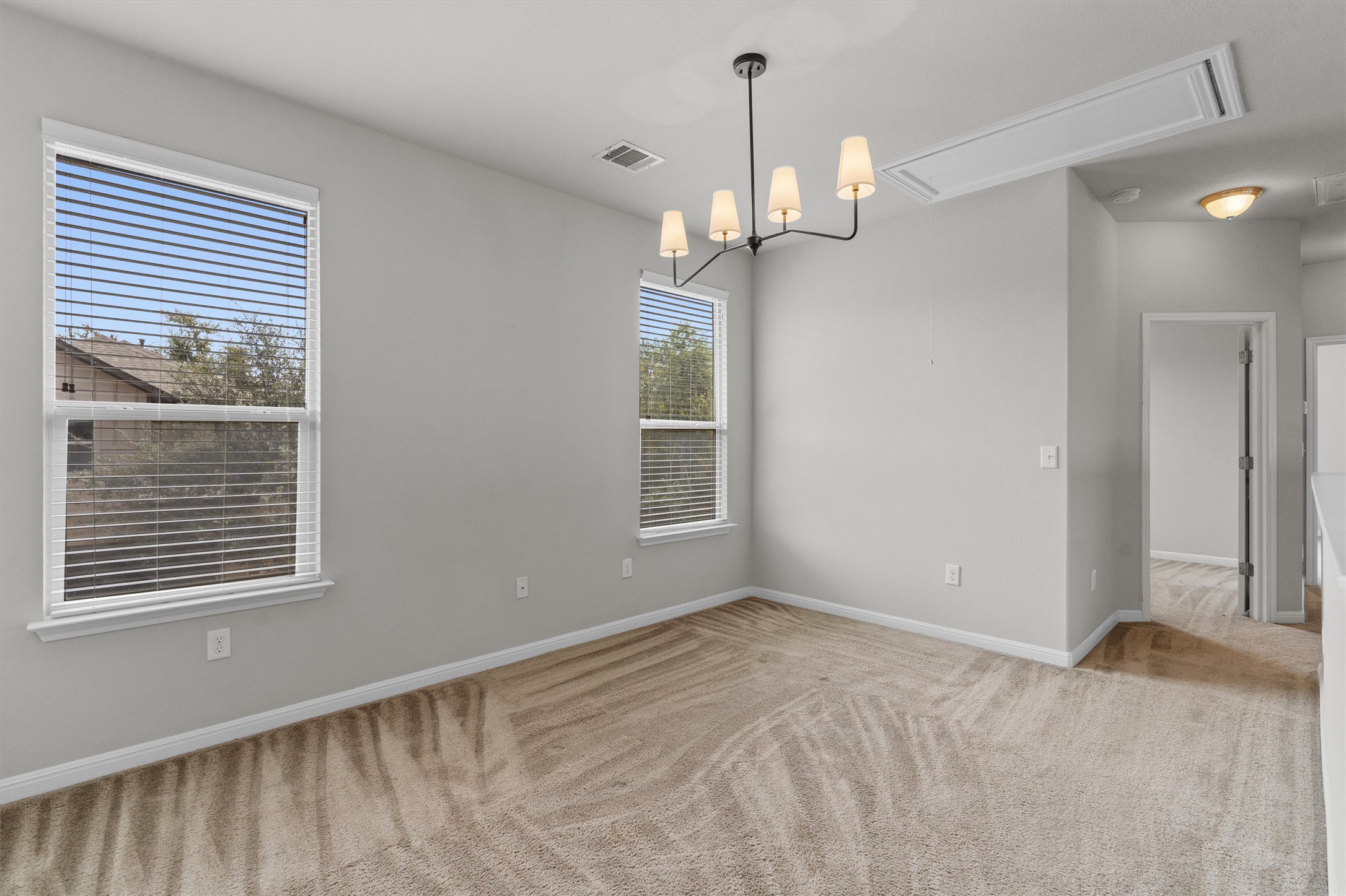 7709 Menchaca Road, Unit 22 Austin, TX 78745 - Photo 19 of 35 a view of empty room with wooden floor and fan