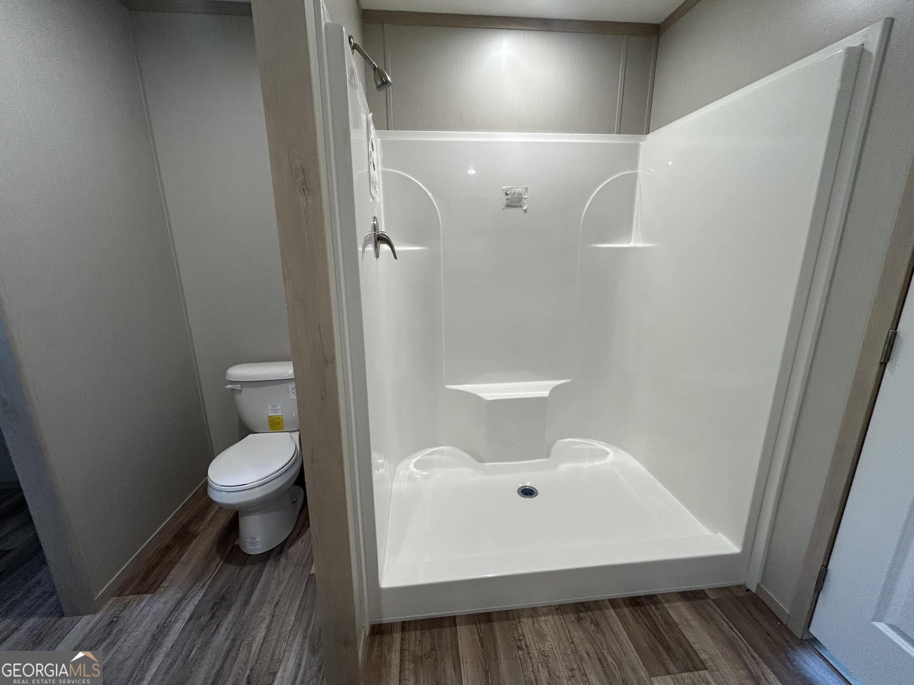640 Elmer Thrift Road Waycross, GA 31503 - Photo 18 of 23 a bathroom with a toilet and a sink