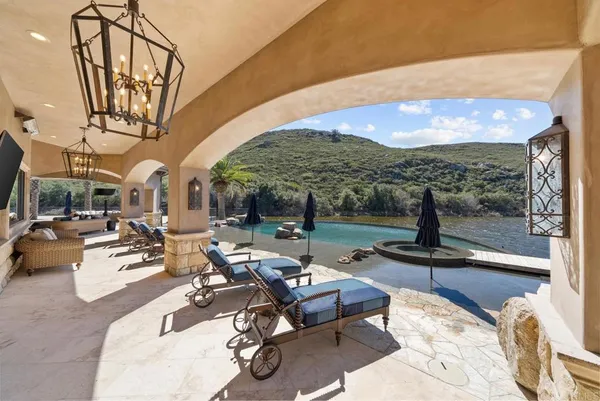 a view of a swimming pool with a patio