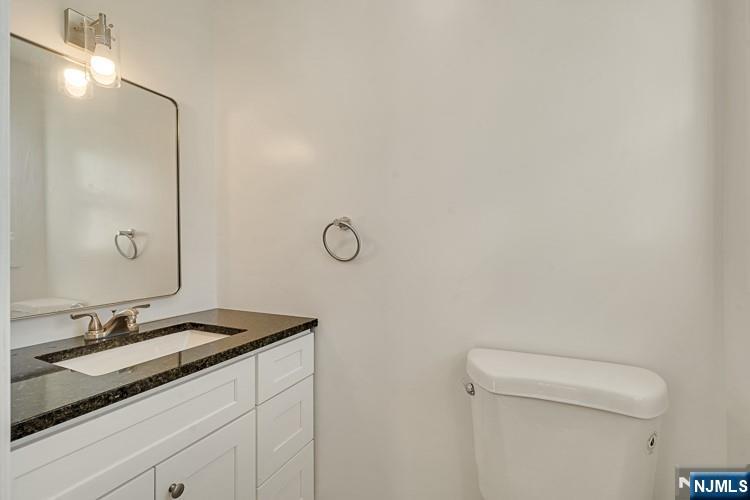 13 Casta Lane, Unit 2 Edgewater, NJ 07020 - Photo 11 of 23 a bathroom with a sink and a toilet