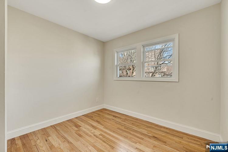 13 Casta Lane, Unit 2 Edgewater, NJ 07020 - Photo 12 of 23 a view of empty room with wooden floor