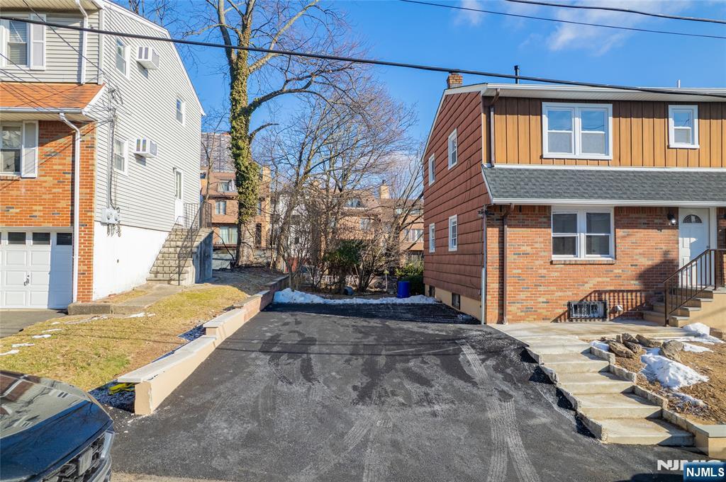 13 Casta Lane, Unit 2 Edgewater, NJ 07020 - Photo 22 of 23 a view of a backyard of the house