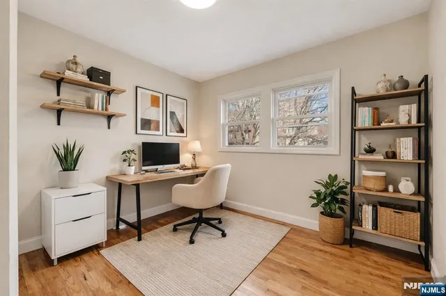 a workspace with furniture and a potted plant