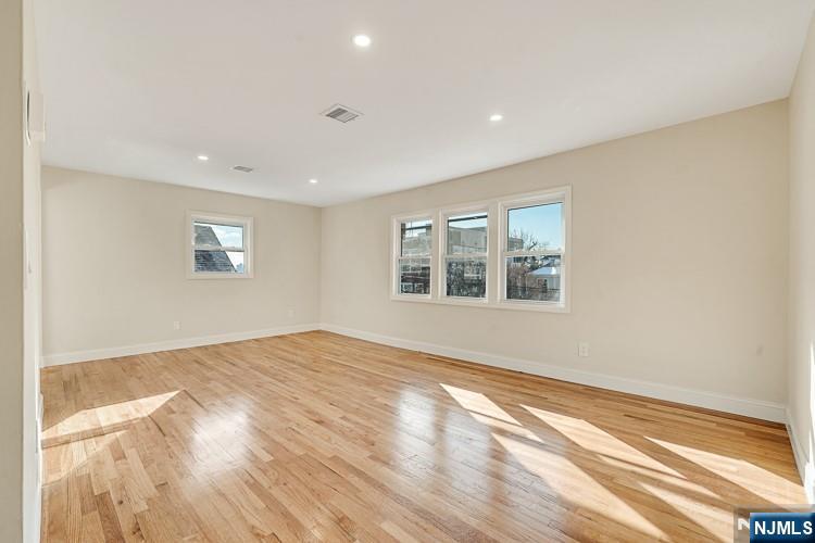 13 Casta Lane, Unit 2 Edgewater, NJ 07020 - Photo 7 of 23 a view of an empty room with a window