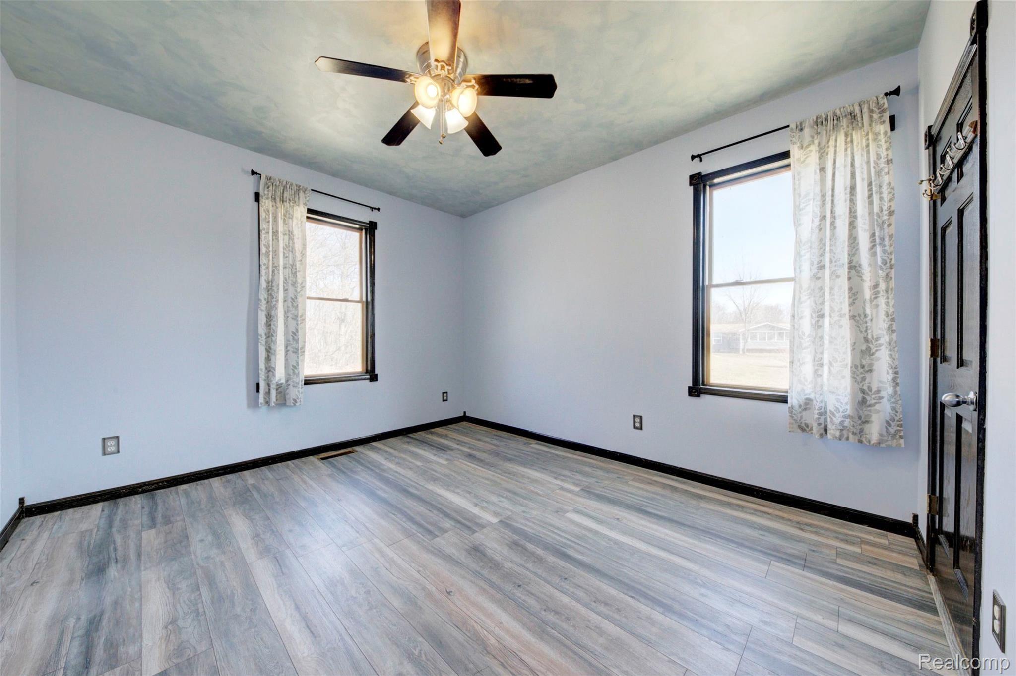 1888 North Briggsville Road Fowlerville, MI 48836 - Photo 29 of 44 back Bedroom.jpg