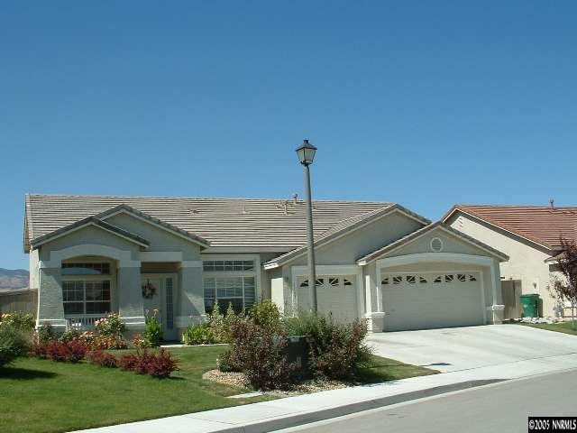 1145 El Campo Court Reno, NV 89521 - Photo 1 of 9 a front view of a house with garden