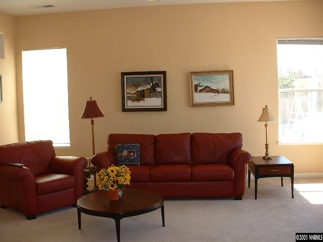 1145 El Campo Court Reno, NV 89521 - Photo 4 of 9 a living room with furniture a couch and a window