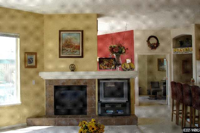 1145 El Campo Court Reno, NV 89521 - Photo 6 of 9 a living room with furniture and a fireplace