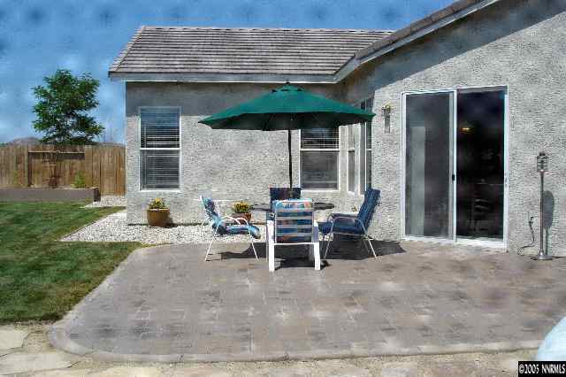 1145 El Campo Court Reno, NV 89521 - Photo 9 of 9 a view of a patio with table and chairs and potted plants