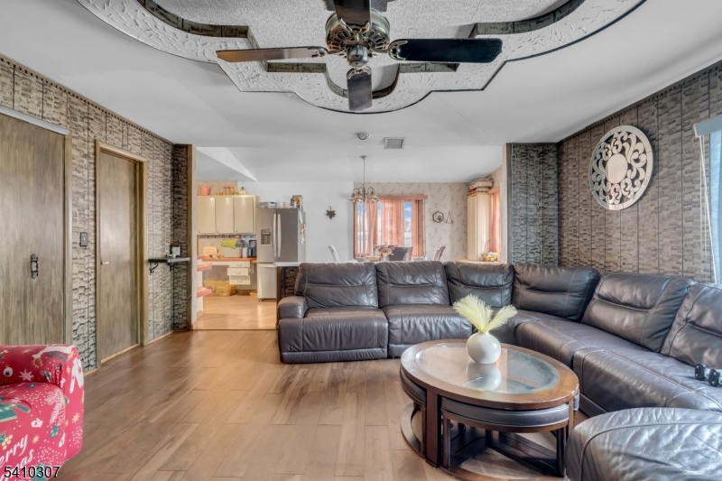 693 Hemlock Street Rahway, NJ 07065 - Photo 11 of 29 a living room with furniture and a chandelier