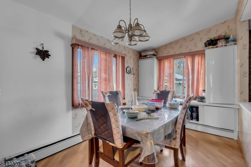 693 Hemlock Street Rahway, NJ 07065 - Photo 13 of 29 a view of a dining room with furniture window and wooden floor