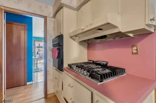 a kitchen with stainless steel appliances a stove and a refrigerator