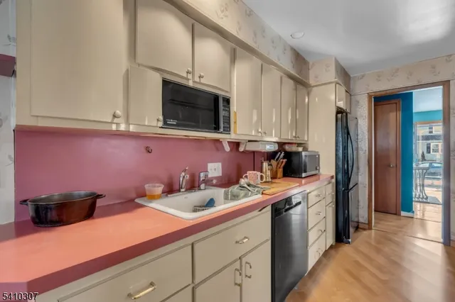 a kitchen with a sink and cabinets