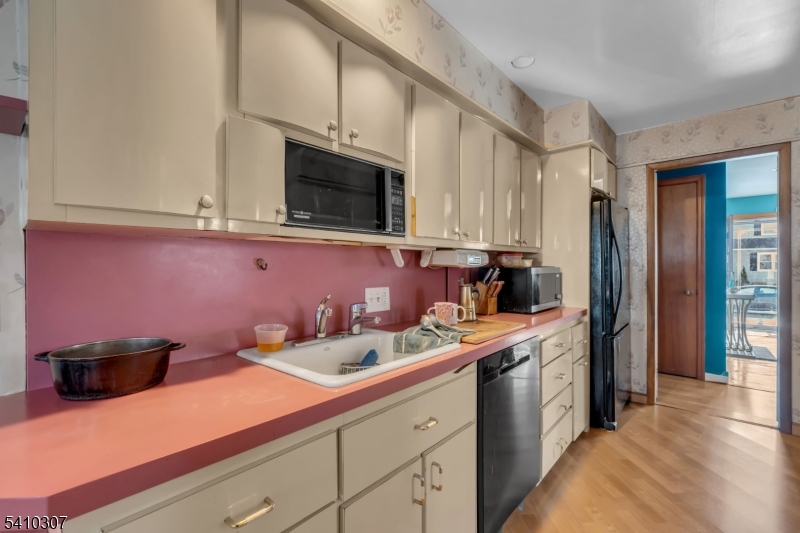 693 Hemlock Street Rahway, NJ 07065 - Photo 16 of 29 a kitchen with a sink and cabinets