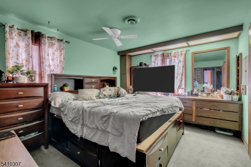 693 Hemlock Street Rahway, NJ 07065 - Photo 20 of 29 a bedroom with a bed and a dresser