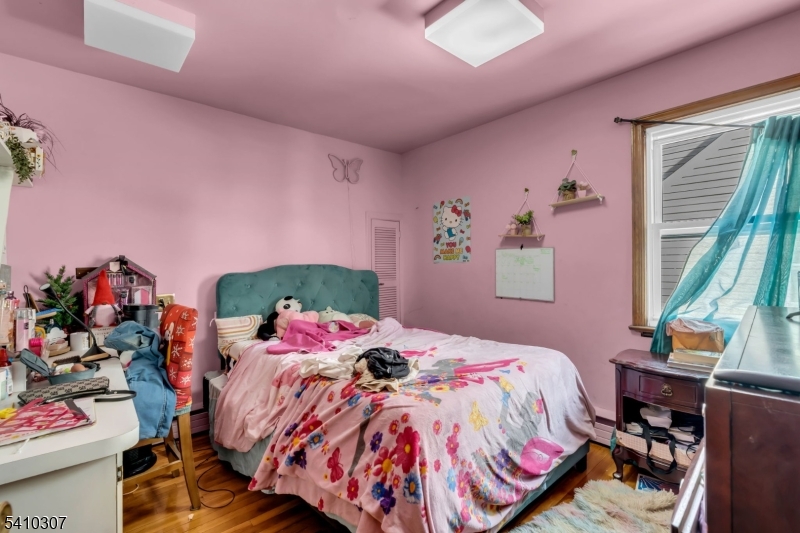 693 Hemlock Street Rahway, NJ 07065 - Photo 21 of 29 a bedroom with a bed and a bed