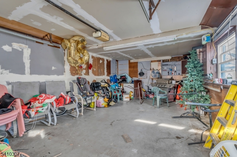 693 Hemlock Street Rahway, NJ 07065 - Photo 29 of 29 a view of a garage with a table and chairs