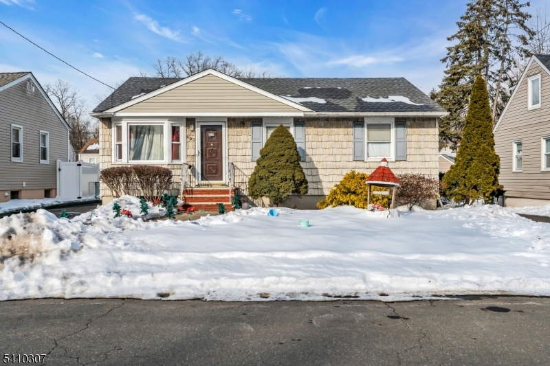 693 Hemlock Street Rahway, NJ 07065 - Photo 3 of 29 a front view of a house with a garage