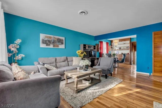a living room with furniture or couch and a bookshelf