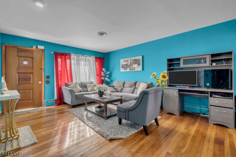 693 Hemlock Street Rahway, NJ 07065 - Photo 6 of 29 a living room with furniture and a wooden floor