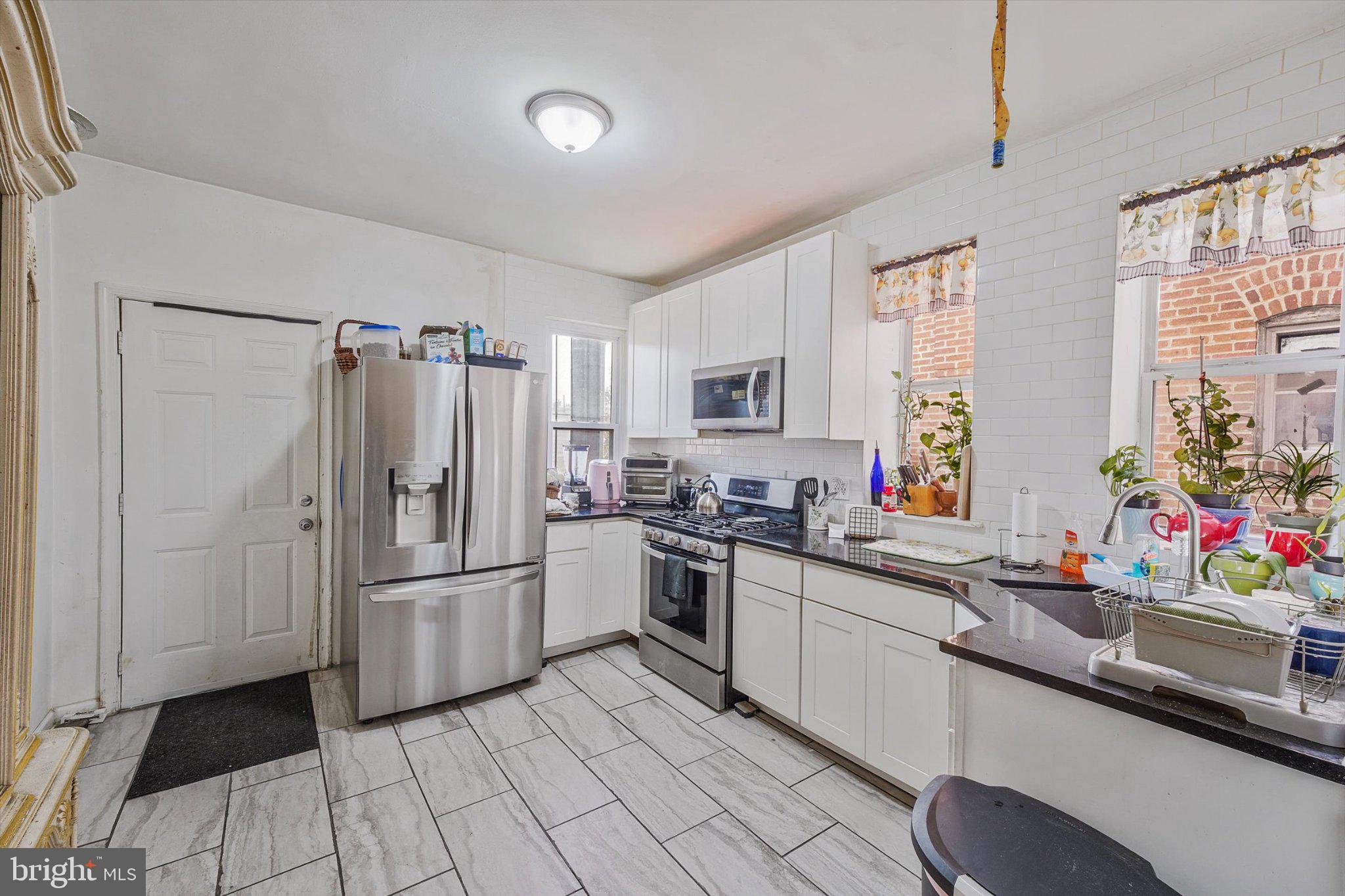 3113 11th Street Northwest Washington, DC 20010 - Photo 13 of 42 Bright and inviting modern kitchen.