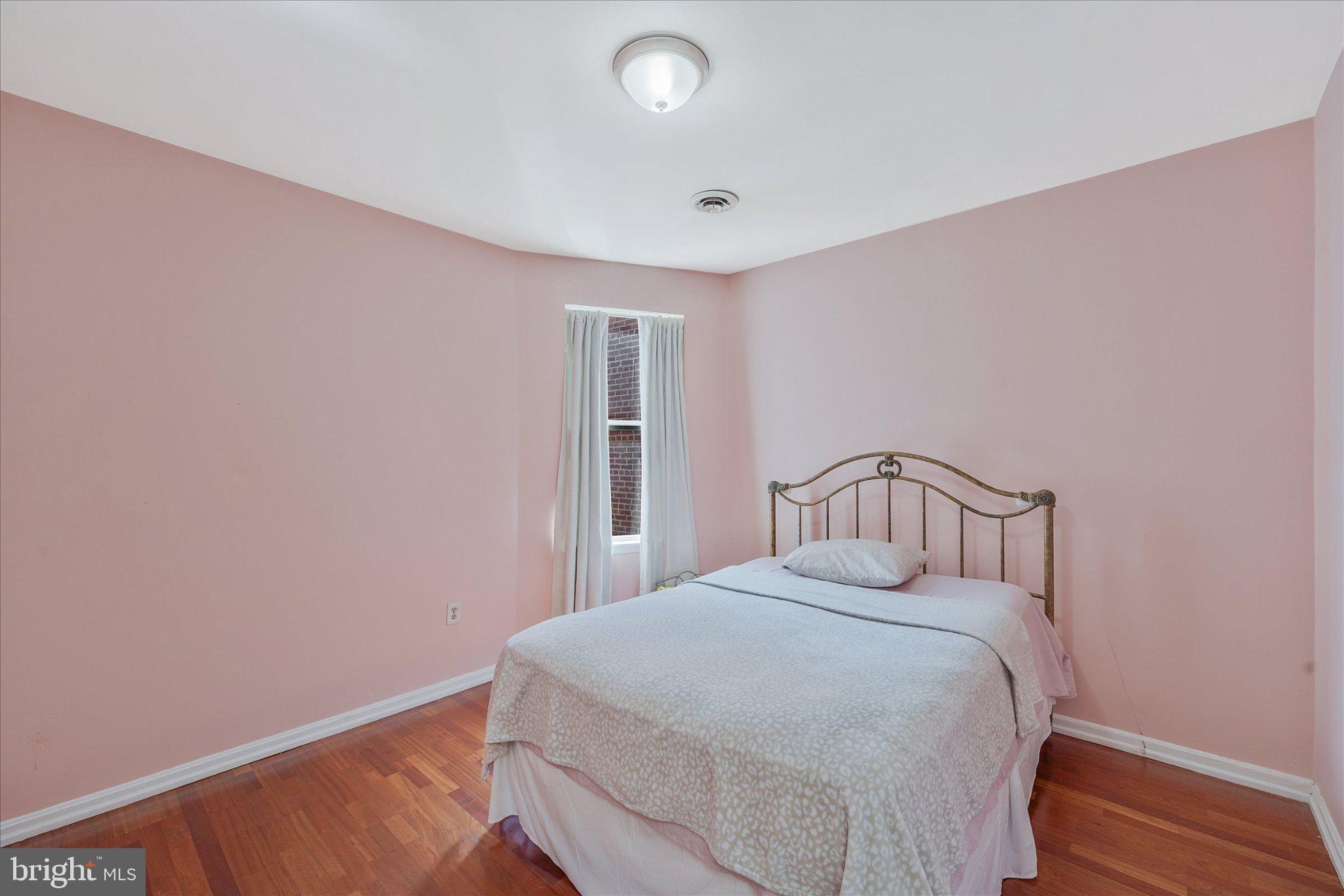 3113 11th Street Northwest Washington, DC 20010 - Photo 19 of 42 Charming pink-hued bedroom retreat.